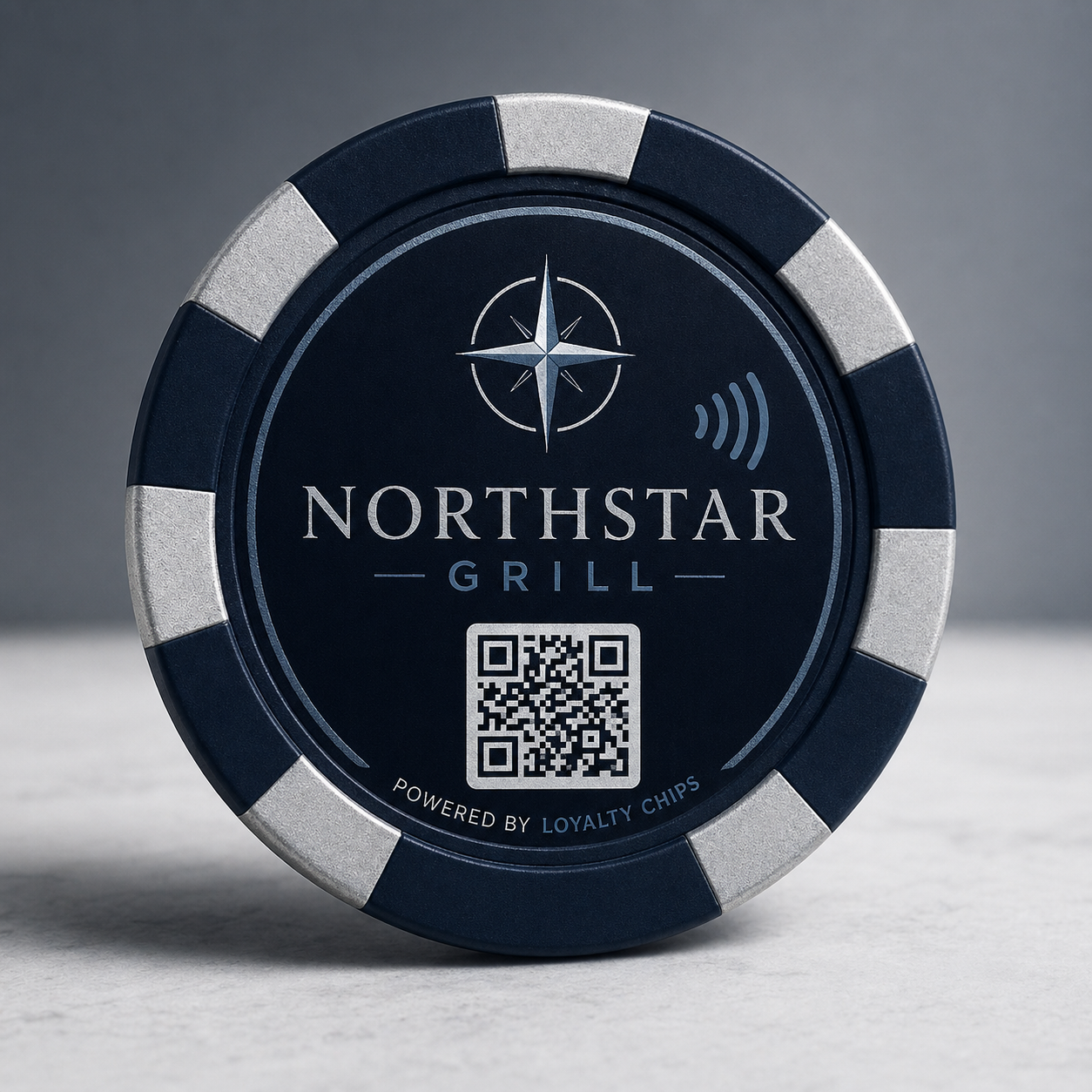 Sample venue-branded NFC + QR loyalty chip photographed on a marble counter.